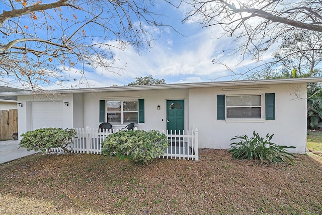 ranch-style home with a garage