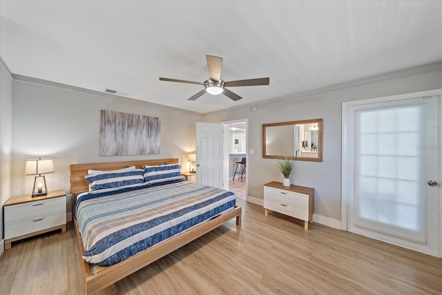 bedroom featuring ornamental molding, light hardwood / wood-style floors, and ceiling fan