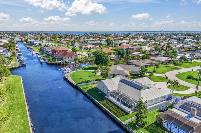 bird's eye view with a residential view and a water view