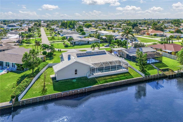 aerial view with a residential view and a water view