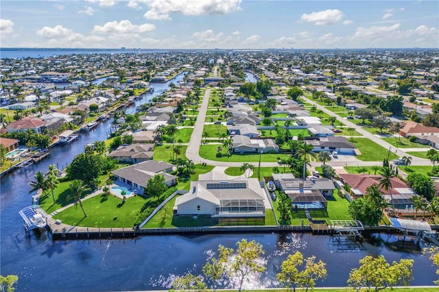 aerial view with a residential view and a water view