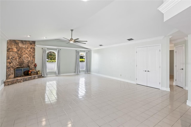 unfurnished living room with light tile patterned floors, baseboards, lofted ceiling, ornamental molding, and a stone fireplace