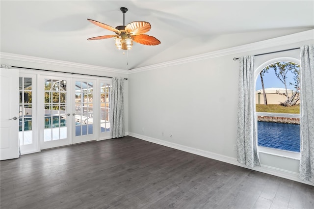 empty room with a wealth of natural light, french doors, dark wood-type flooring, and vaulted ceiling