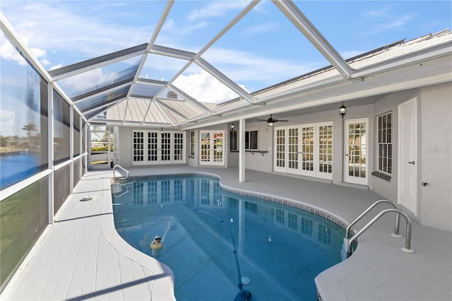 pool with a lanai, french doors, a patio, and ceiling fan