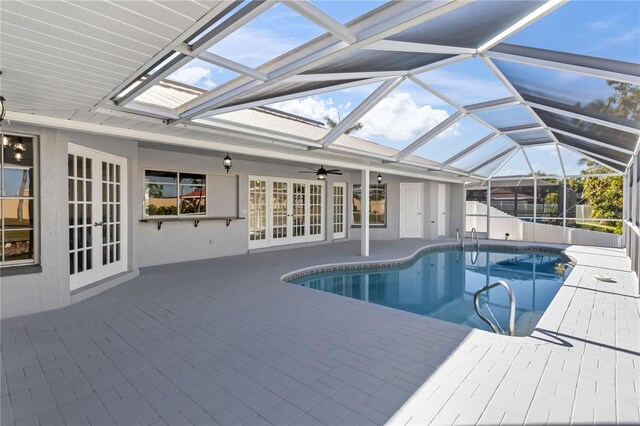 view of swimming pool with a patio, french doors, a fenced in pool, and ceiling fan