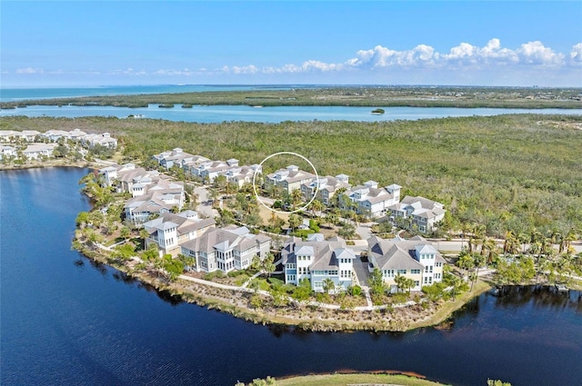 drone / aerial view featuring a water view and a residential view