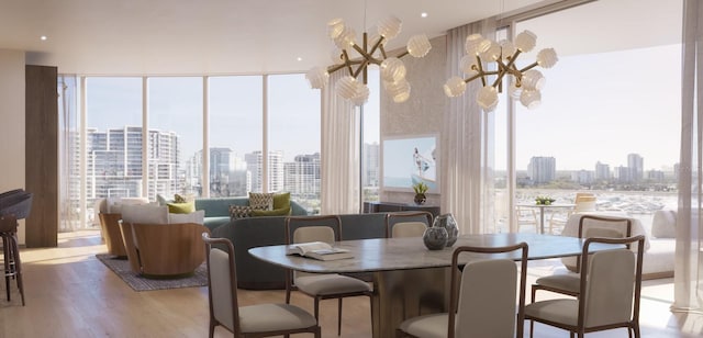 dining room featuring expansive windows, hardwood / wood-style flooring, an inviting chandelier, and a healthy amount of sunlight