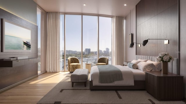 bedroom featuring floor to ceiling windows and light hardwood / wood-style floors