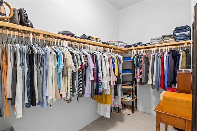 walk in closet featuring hardwood / wood-style floors