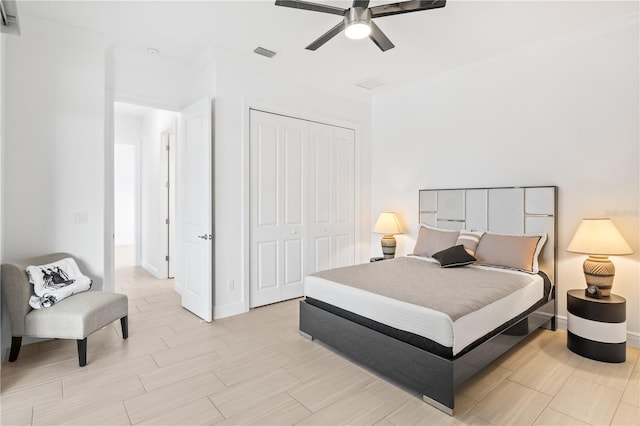 bedroom with ceiling fan and a closet