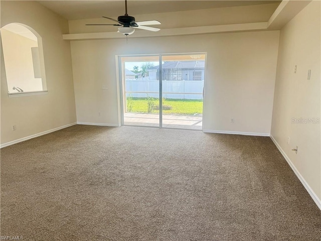 empty room with ceiling fan and carpet flooring