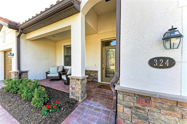 property entrance featuring a porch