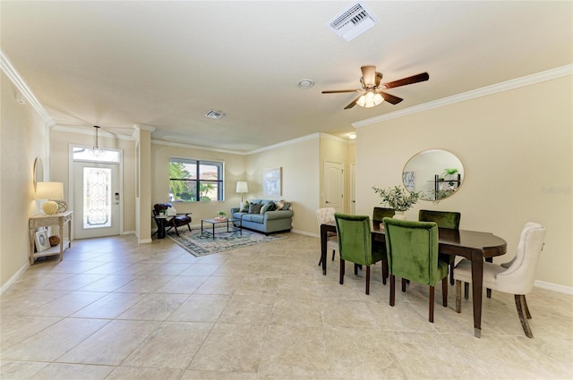 dining area with light tile patterned flooring, ceiling fan, and ornamental molding