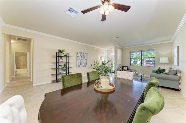 dining room with ornamental molding and ceiling fan