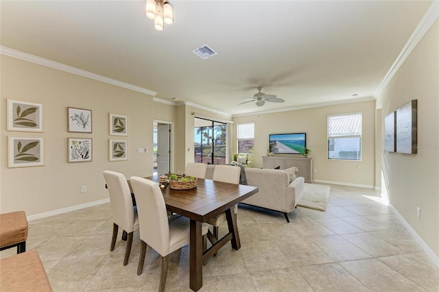 dining space with ornamental molding, ceiling fan, and light tile patterned flooring