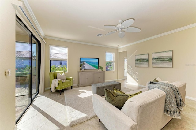 tiled living room with crown molding, plenty of natural light, and ceiling fan