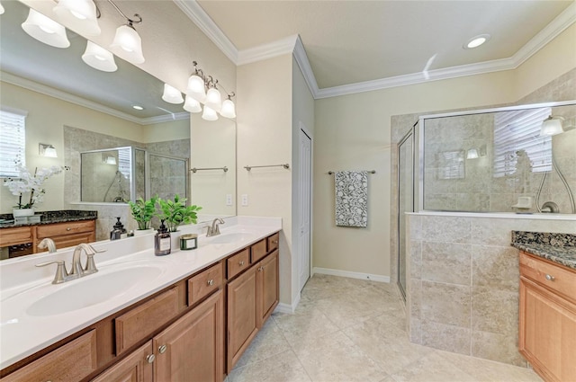 bathroom featuring vanity, an enclosed shower, crown molding, and tile patterned floors