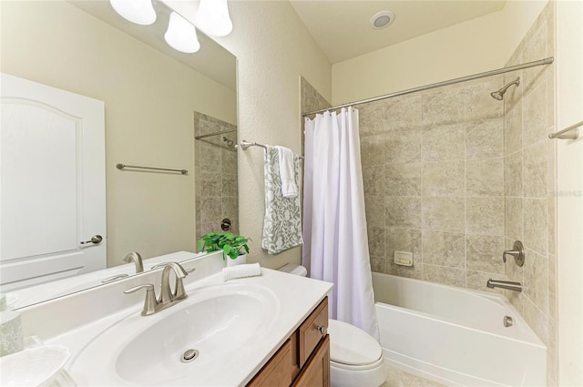 full bathroom featuring vanity, shower / bath combo, and toilet