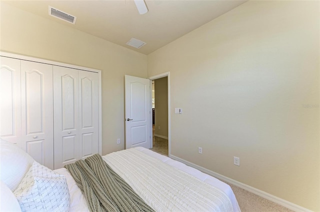 bedroom featuring light carpet, a closet, and ceiling fan