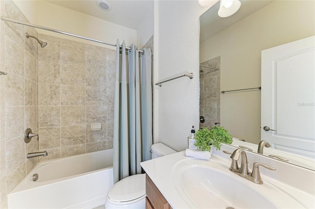 full bathroom featuring vanity, toilet, and shower / tub combo