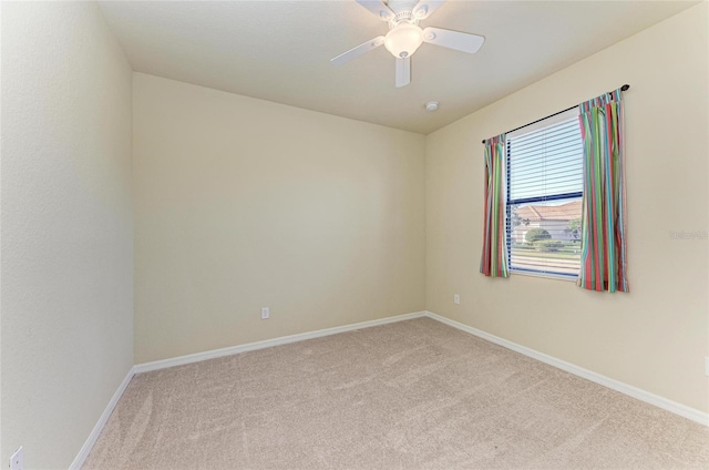 unfurnished room with light carpet and ceiling fan