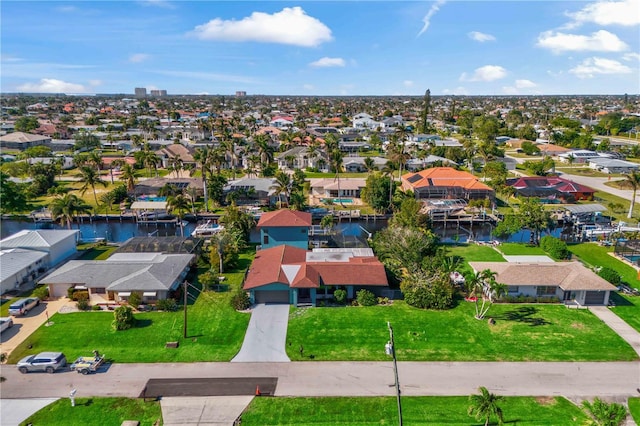 aerial view featuring a water view and a residential view