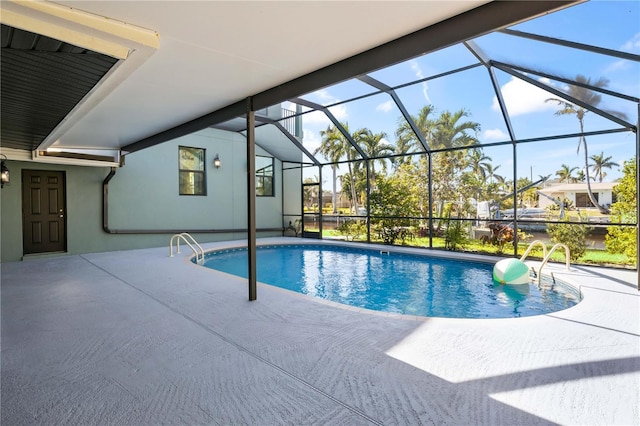 outdoor pool featuring a lanai and a patio