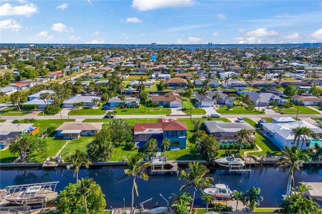 aerial view with a water view and a residential view