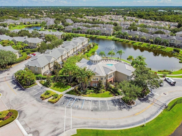 bird's eye view with a water view and a residential view