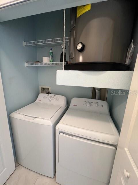 7632 Plantation Cir, Bradenton, FL 34201 - washroom with laundry area, independent washer and dryer, and light tile patterned flooring