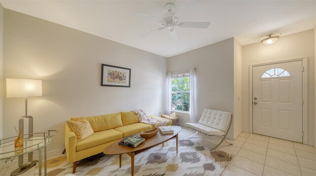 7632 Plantation Cir, Bradenton, FL 34201 - living room featuring light tile patterned floors, baseboards, and a ceiling fan