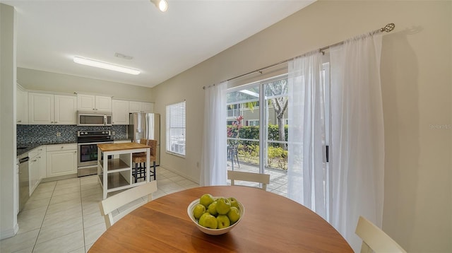7632 Plantation Cir, Bradenton, FL 34201 - dining room featuring light tile patterned floors and visible vents