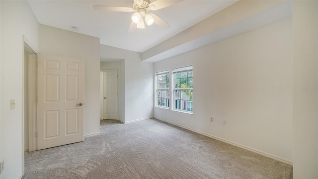 7632 Plantation Cir, Bradenton, FL 34201 - empty room featuring carpet floors, baseboards, and a ceiling fan