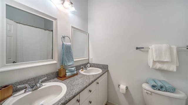 7632 Plantation Cir, Bradenton, FL 34201 - bathroom with double vanity, a sink, toilet, and a shower with curtain