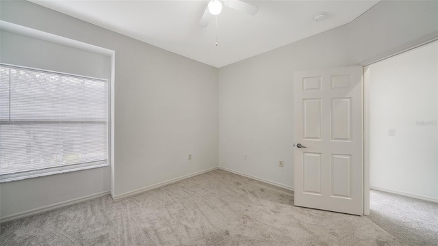 7632 Plantation Cir, Bradenton, FL 34201 - spare room featuring vaulted ceiling, carpet flooring, ceiling fan, and baseboards