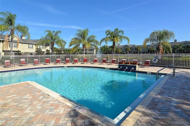 7632 Plantation Cir, Bradenton, FL 34201 - community pool with a patio area, fence, and a residential view