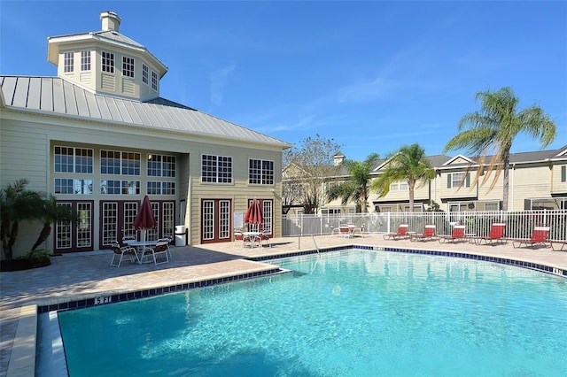 7632 Plantation Cir, Bradenton, FL 34201 - community pool featuring a patio, french doors, and fence