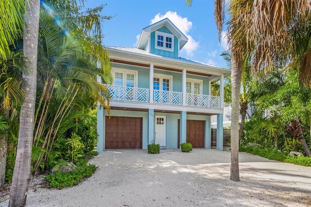 418 Magnolia Ave, Anna Maria, FL 34216 - raised beach house featuring a garage
