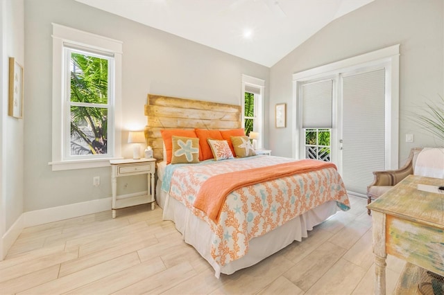 bedroom featuring lofted ceiling and light hardwood / wood-style flooring