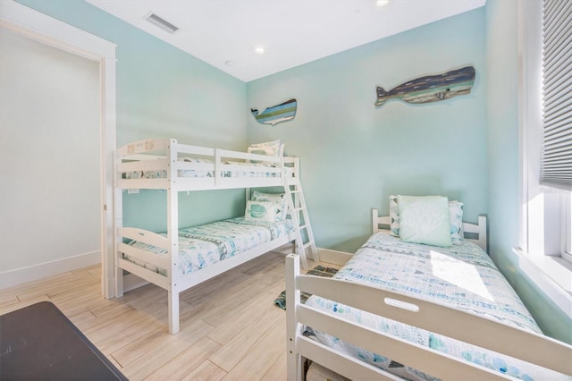 bedroom with light hardwood / wood-style flooring