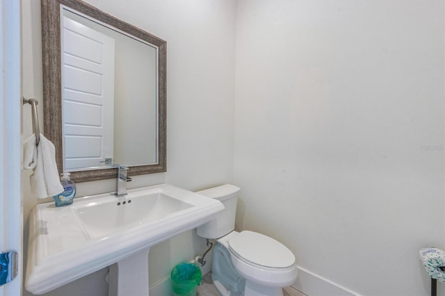 bathroom with sink and toilet