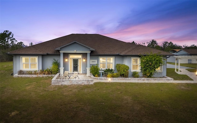 view of front of home featuring a yard