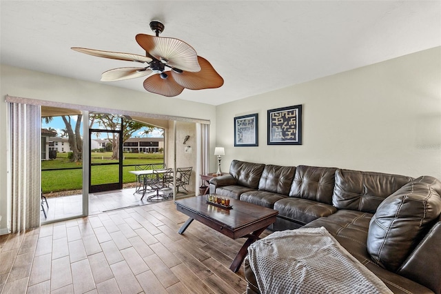 living room featuring hardwood / wood-style flooring and ceiling fan