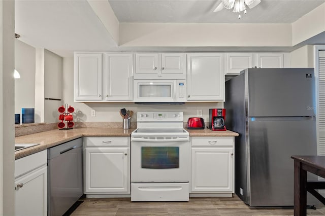 kitchen with white cabinetry, light hardwood / wood-style flooring, ceiling fan, and appliances with stainless steel finishes