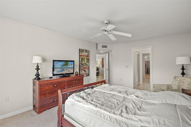 bedroom with light colored carpet and ceiling fan