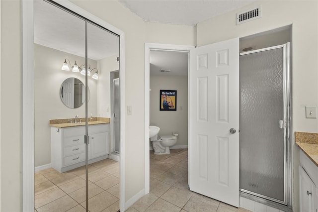 bathroom with vanity, an enclosed shower, tile patterned floors, and toilet