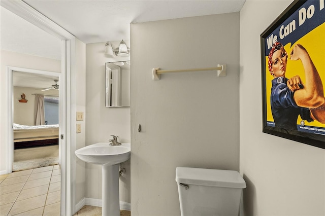 bathroom with toilet and tile patterned flooring