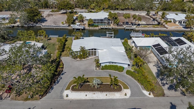 birds eye view of property with a residential view and a water view