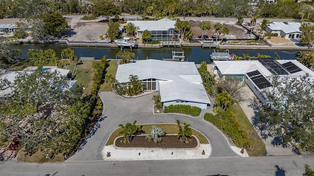 aerial perspective of suburban area featuring a nearby body of water