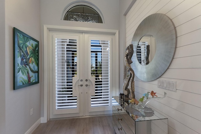 entryway featuring light hardwood / wood-style flooring and french doors